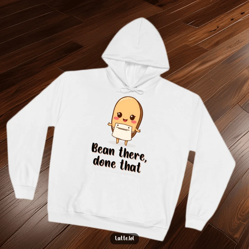 Funny hoodie displaying a coffee bean character wearing a tiny apron, perfect for cozy coffee moments.