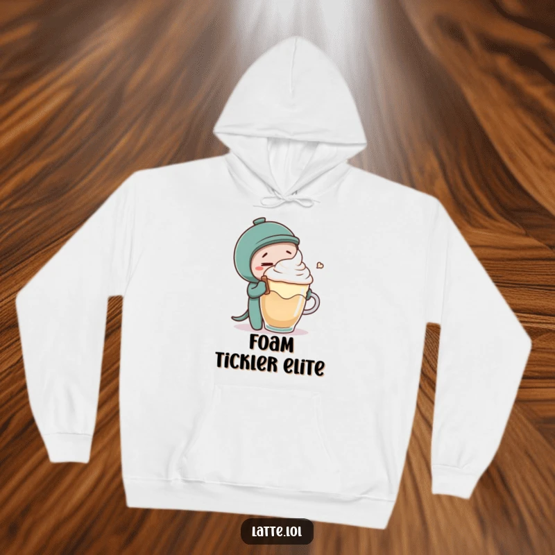 Funny hoodie showing a mischievous coffee stirrer tickling latte foam, a cozy and humorous piece for relaxation.