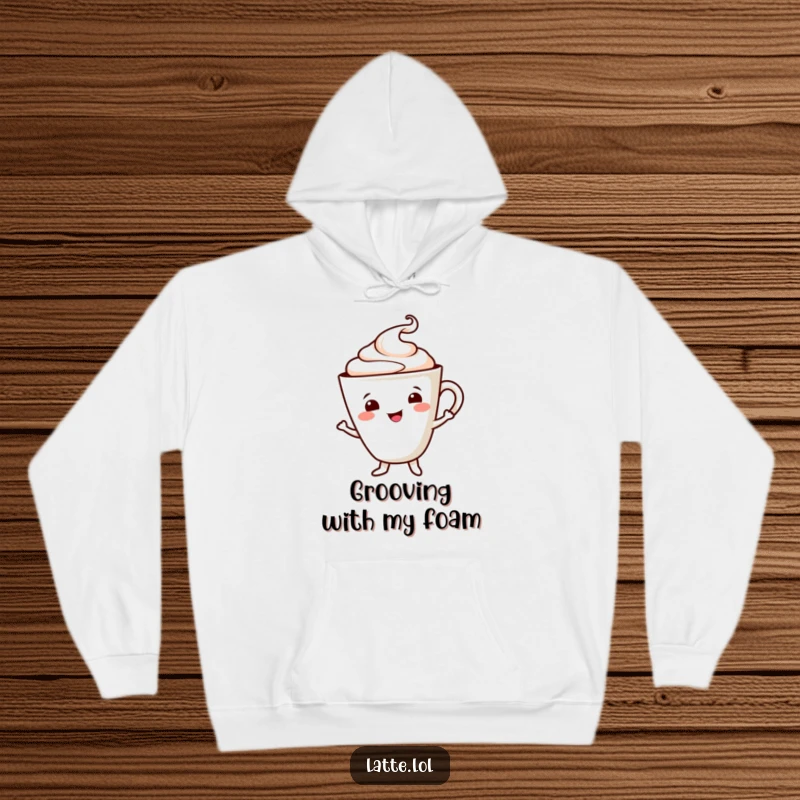 Funny hoodie featuring a smiling latte cup character in a cheerful dance, foam swirl accentuating the fun. Comfortable and cute.